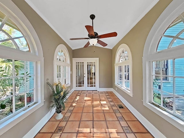 unfurnished sunroom with ceiling fan, french doors, vaulted ceiling, and a wealth of natural light