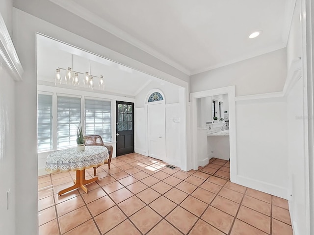 tiled entrance foyer with vaulted ceiling