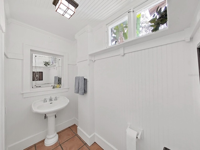 bathroom featuring tile patterned flooring and ornamental molding