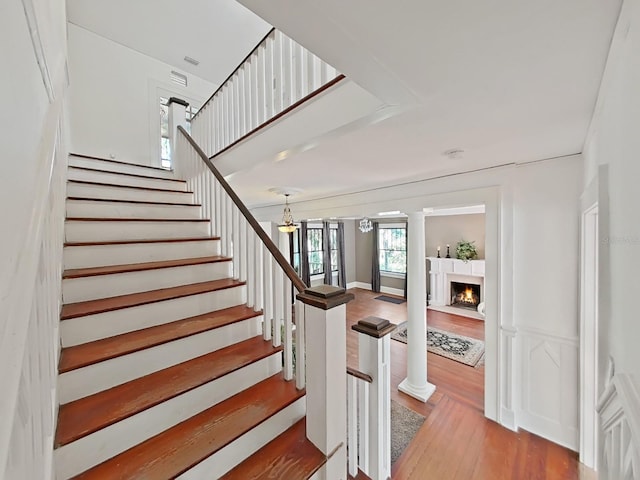 stairs featuring wood-type flooring