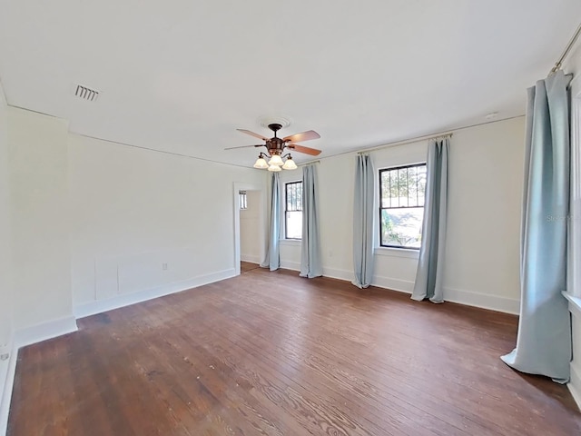 unfurnished room featuring dark hardwood / wood-style flooring and ceiling fan