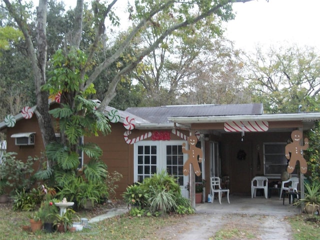 rear view of property featuring an attached carport