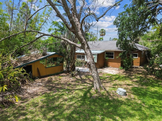 6420 Oelsner St, New Port Richey, FL 34652 - back of house with a lawn