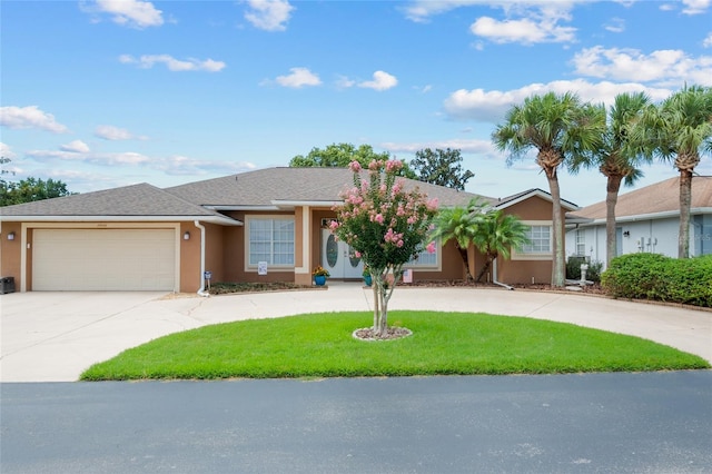 ranch-style home with a garage and a front lawn