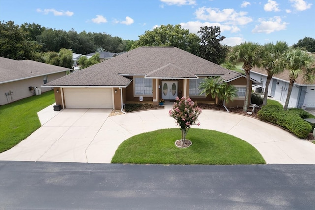 view of front of home featuring a front lawn and a garage