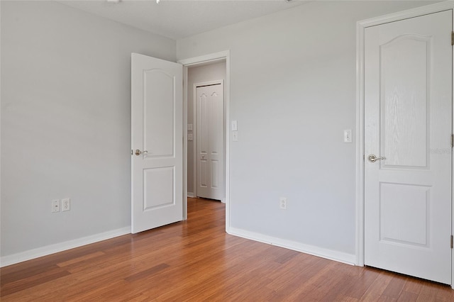 spare room with hardwood / wood-style flooring