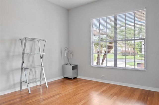 spare room featuring hardwood / wood-style flooring