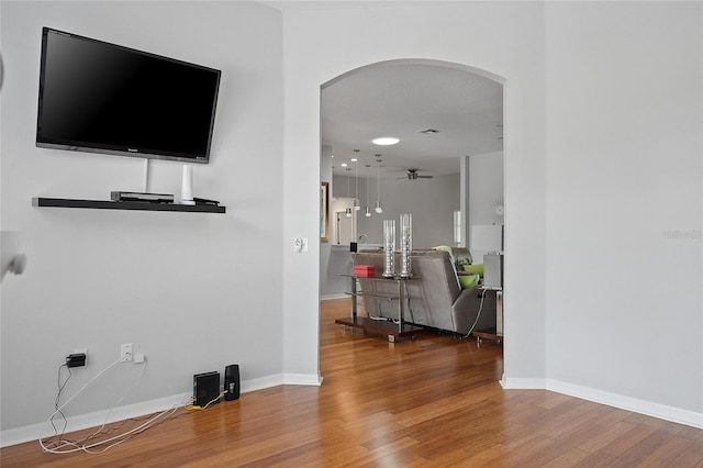 hallway with hardwood / wood-style floors