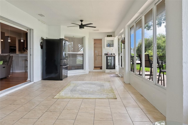 view of patio featuring ceiling fan