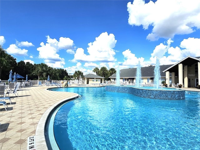 view of pool with pool water feature