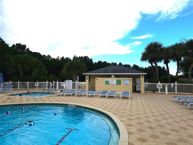 view of pool featuring a patio