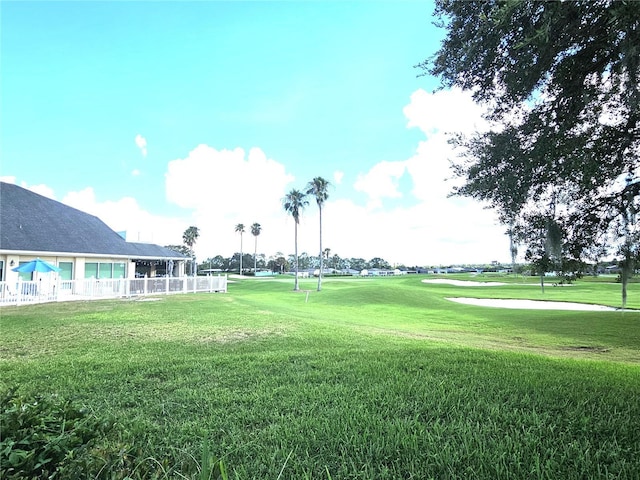 view of property's community with a yard