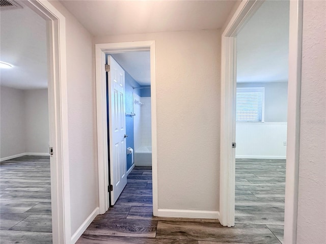 hall featuring dark wood-type flooring