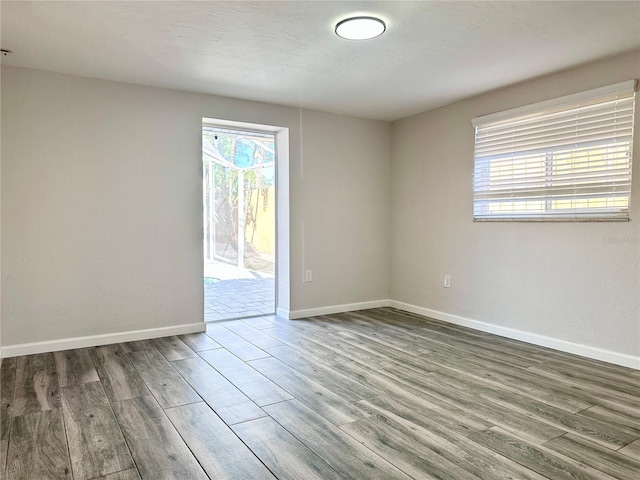 spare room featuring hardwood / wood-style flooring