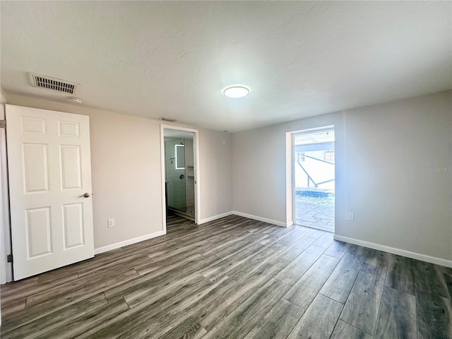 unfurnished room featuring dark hardwood / wood-style floors