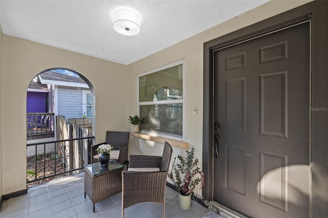 entrance to property featuring a balcony