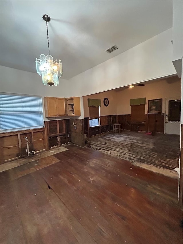 interior space with dark hardwood / wood-style flooring and an inviting chandelier