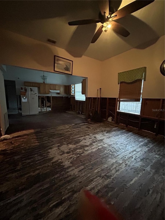 interior space with ceiling fan and dark hardwood / wood-style flooring