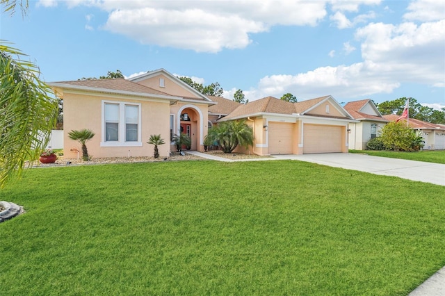 ranch-style home with a garage and a front lawn