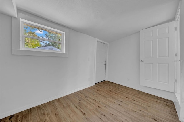 unfurnished room with light hardwood / wood-style flooring