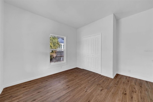 unfurnished room featuring hardwood / wood-style floors