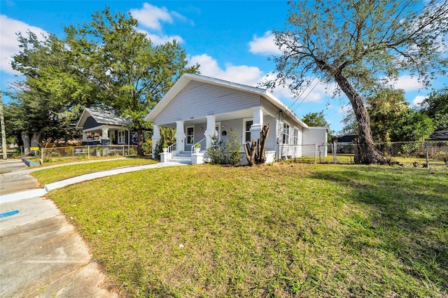 view of front of property featuring a front lawn and a porch