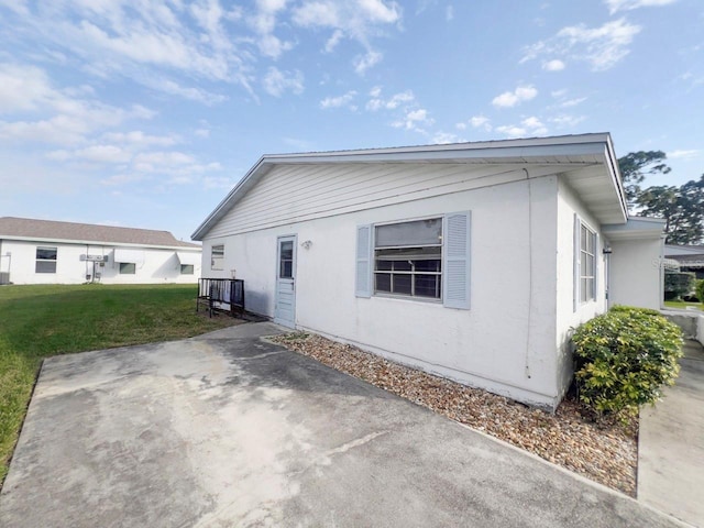 view of side of home featuring a yard