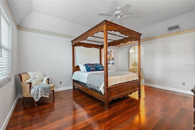 bedroom with ceiling fan, dark wood-type flooring, and vaulted ceiling