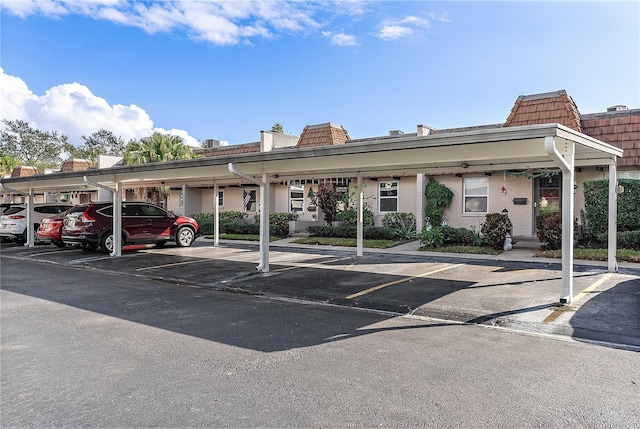 view of parking / parking lot with a carport