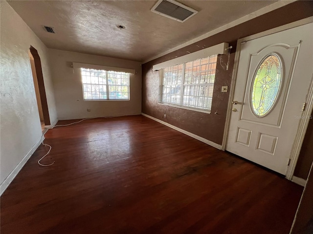 foyer with dark hardwood / wood-style floors