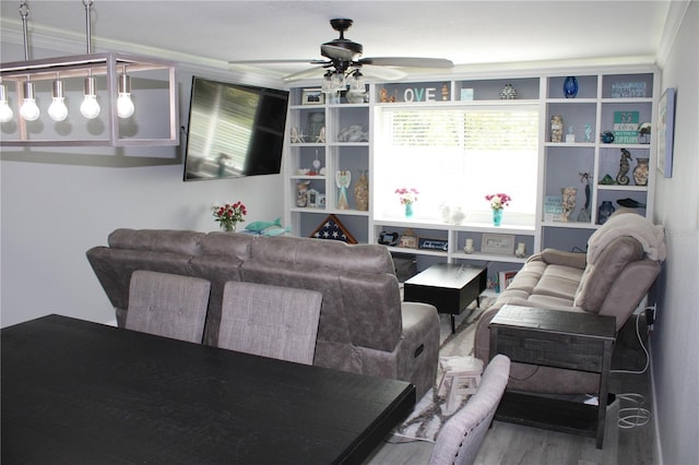 living room with wood finished floors and a ceiling fan