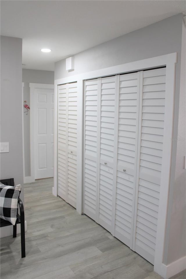 hallway with wood finished floors and recessed lighting