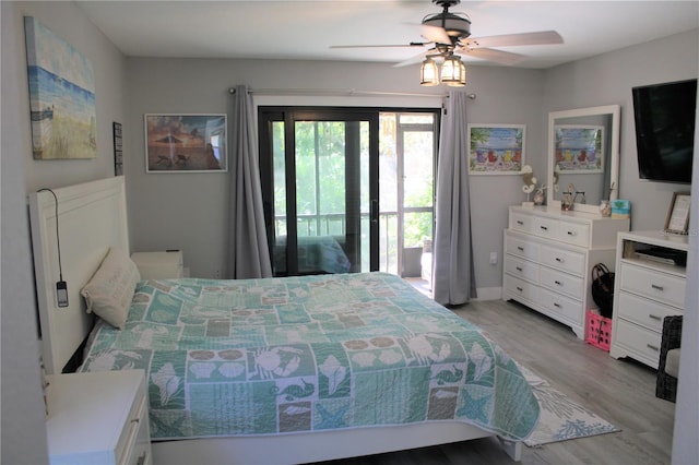 bedroom with wood finished floors, a ceiling fan, and access to exterior