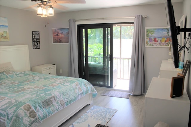 bedroom with access to exterior and light wood-style floors