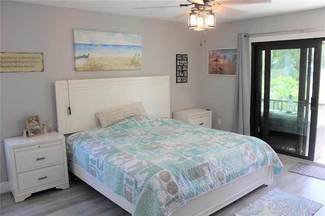 bedroom with light wood-type flooring, access to outside, and ceiling fan