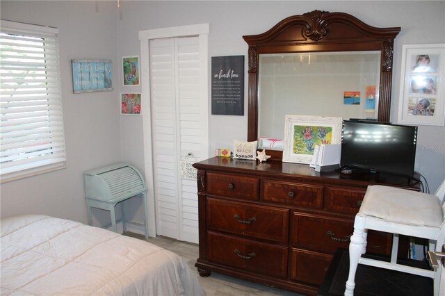 bedroom with multiple windows