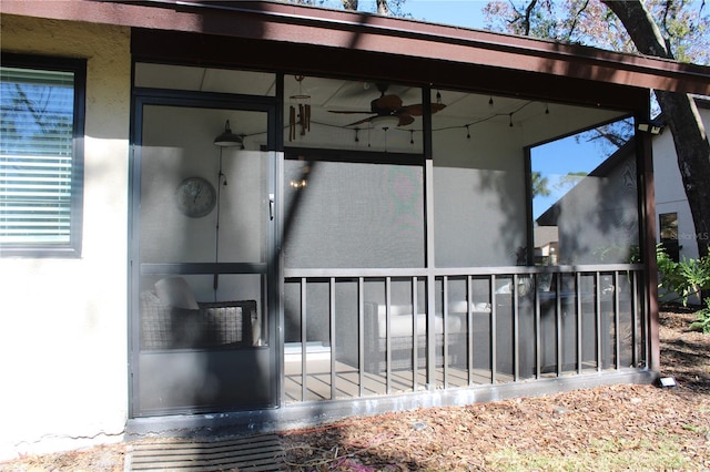 view of patio featuring a sunroom