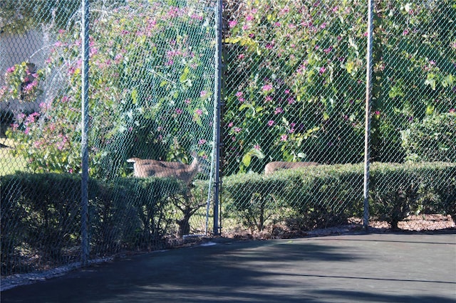 view of gate with fence