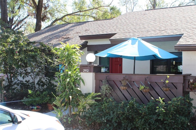 view of front of home with a shingled roof