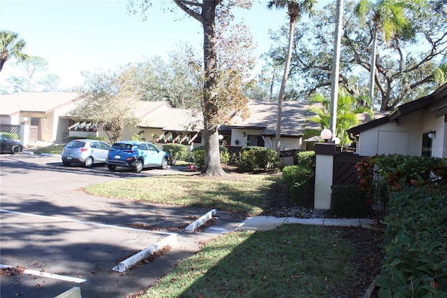 exterior space with a residential view and fence