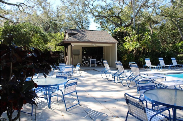 view of patio / terrace with outdoor dining area and a community pool