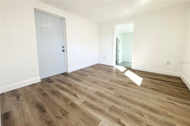 empty room with wood-type flooring