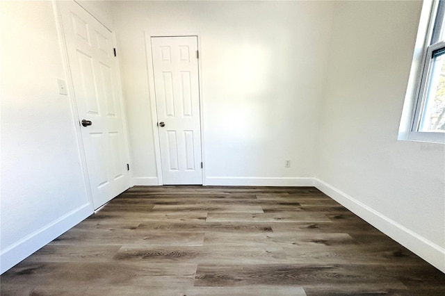 empty room featuring dark hardwood / wood-style floors