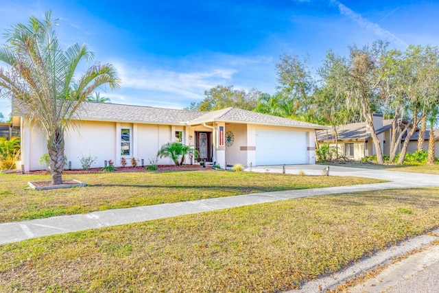 single story home featuring a garage and a front yard