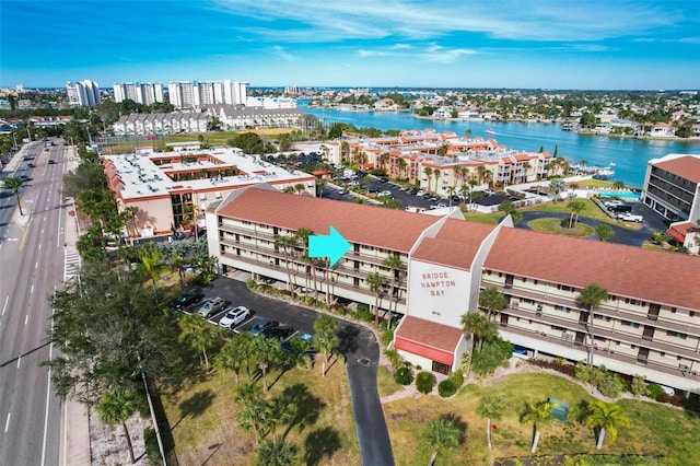 birds eye view of property featuring a water view