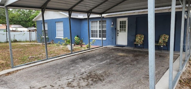 exterior space featuring a carport