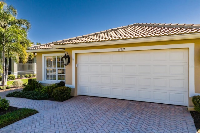 view of front of property with a garage