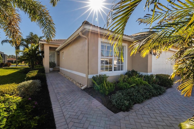 view of property exterior featuring a garage