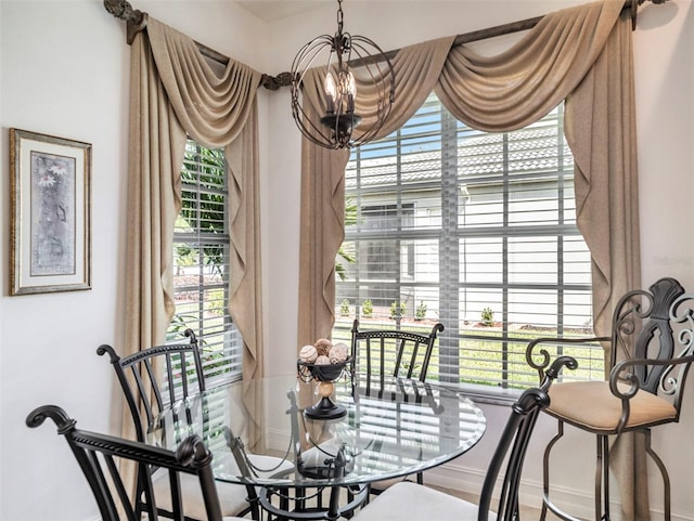 dining space with a notable chandelier