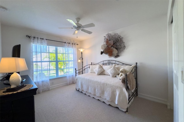 bedroom with ceiling fan and carpet